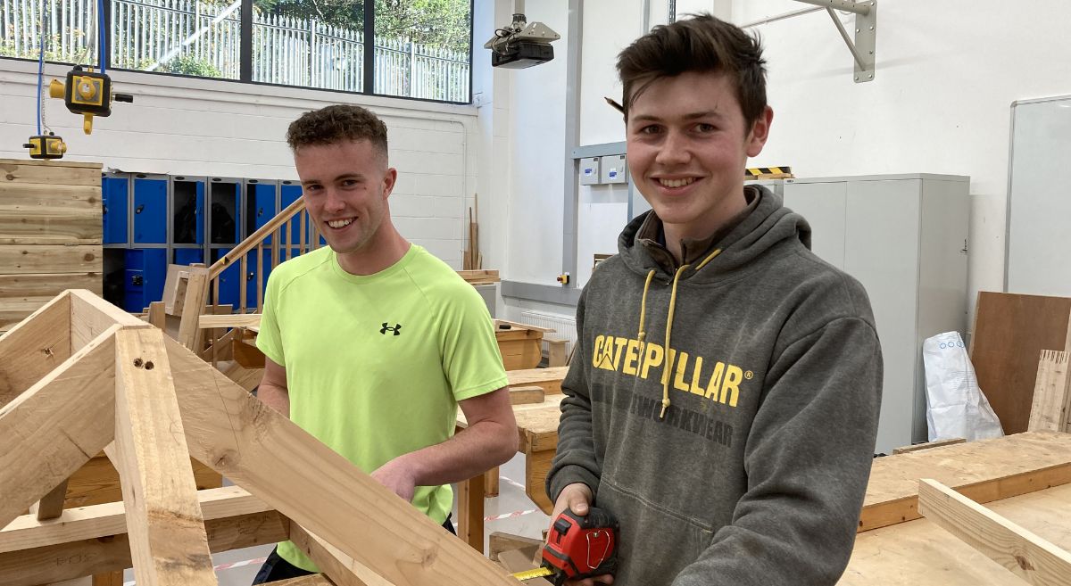 Luke McIlwrath and Dylan Ewing prep for competition in joinery workshop